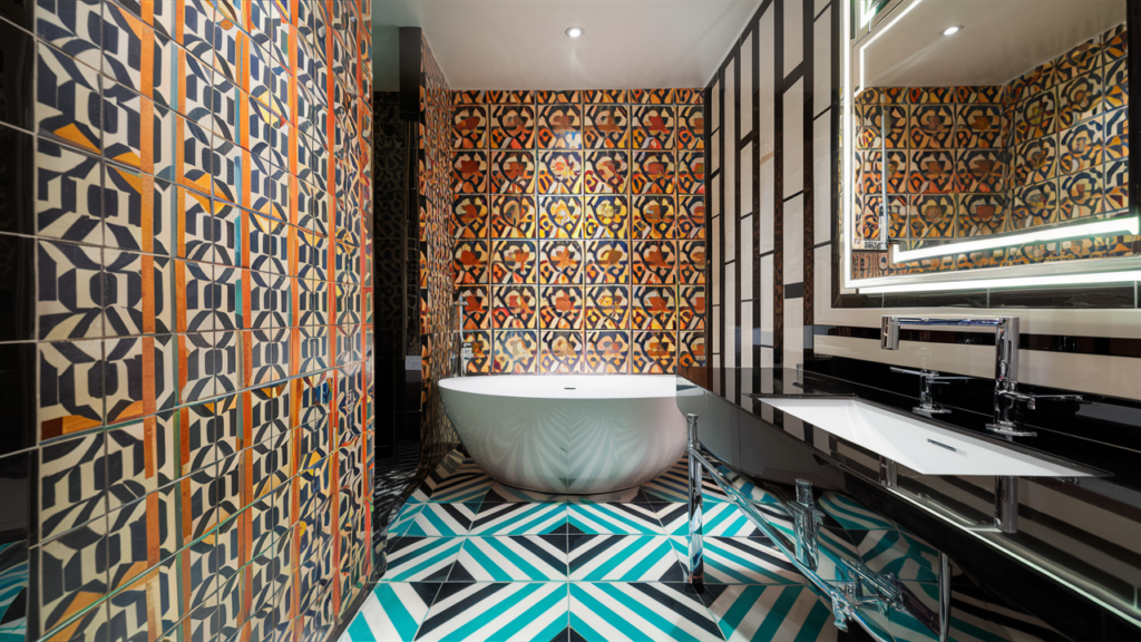 A stunningly modern bathroom, featuring vibrant geometric-patterned tiles