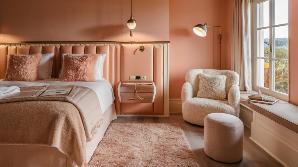 A warm and inviting guest room in soft peach and cream tones