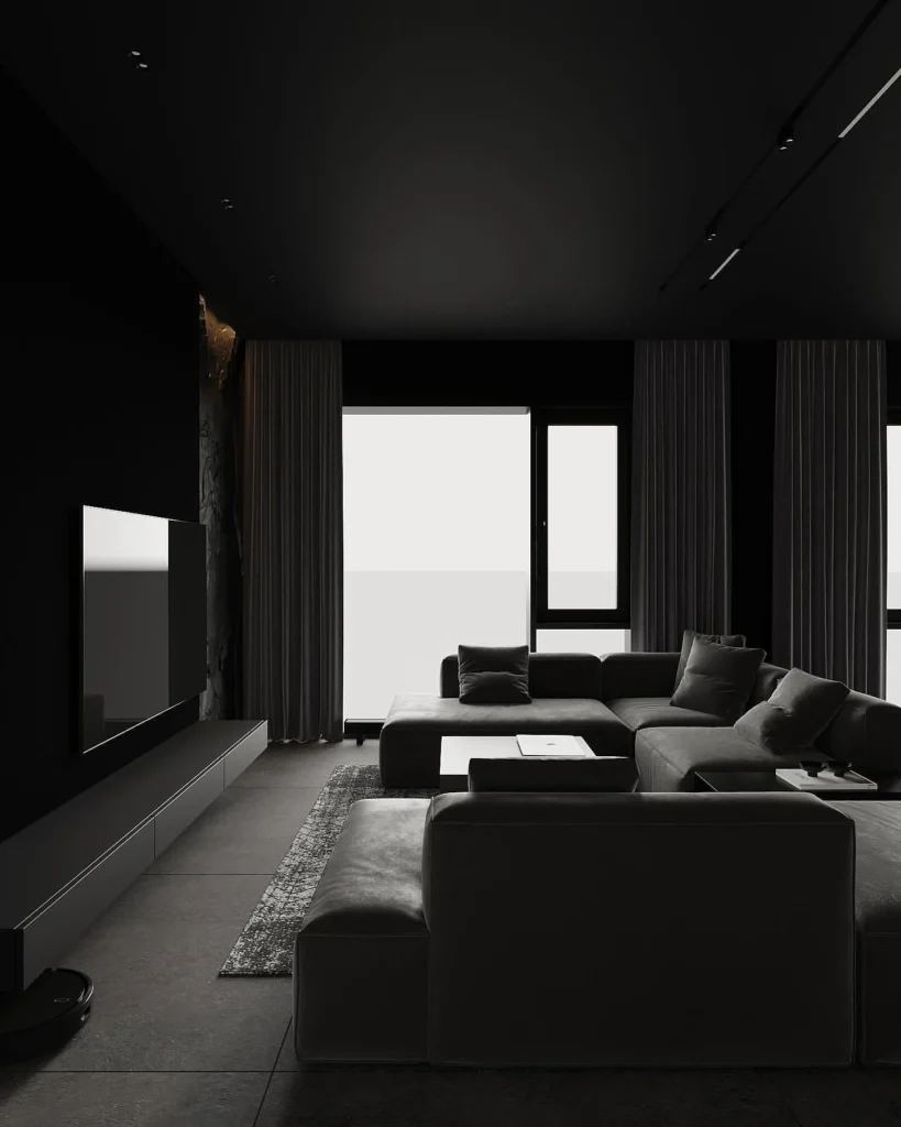 A Cozy, Dark Interior With Soft Seating