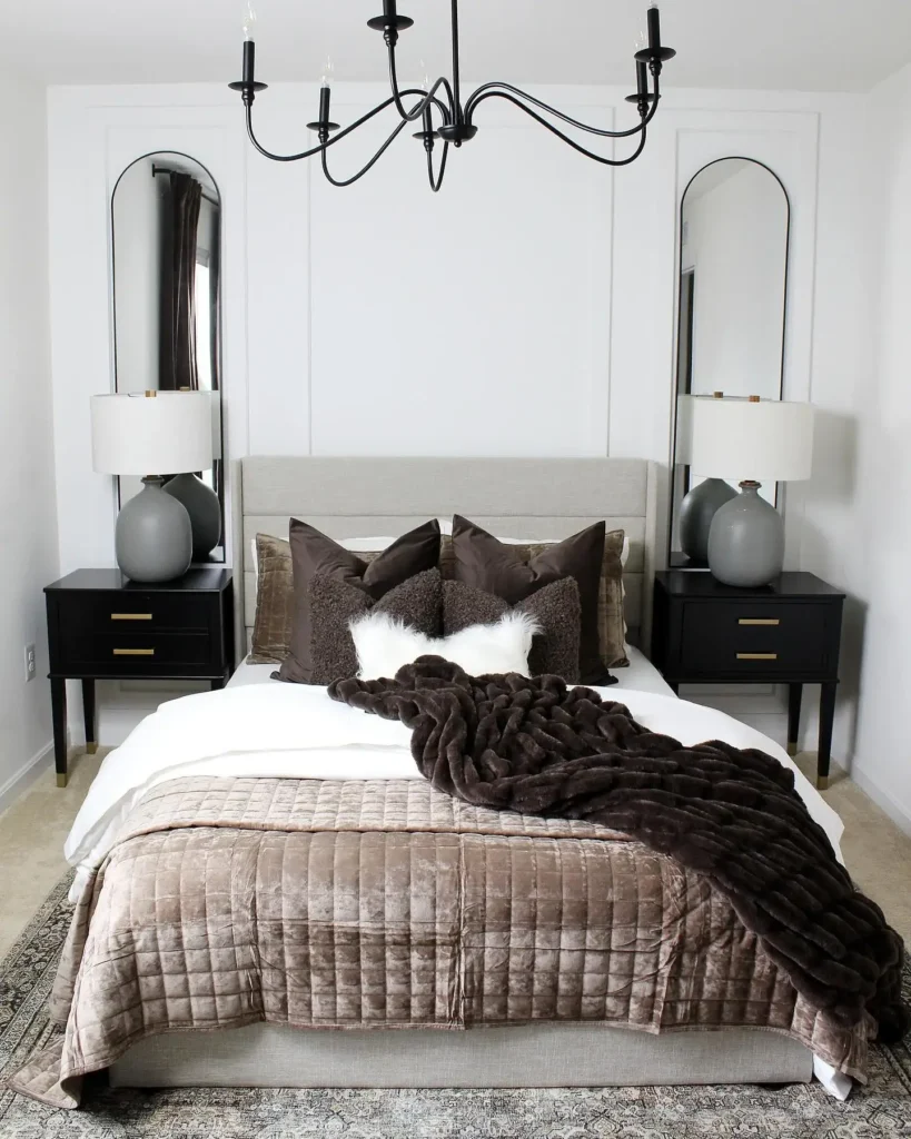 A Bedroom With A High Ceiling And Wooden Beams For Warmth