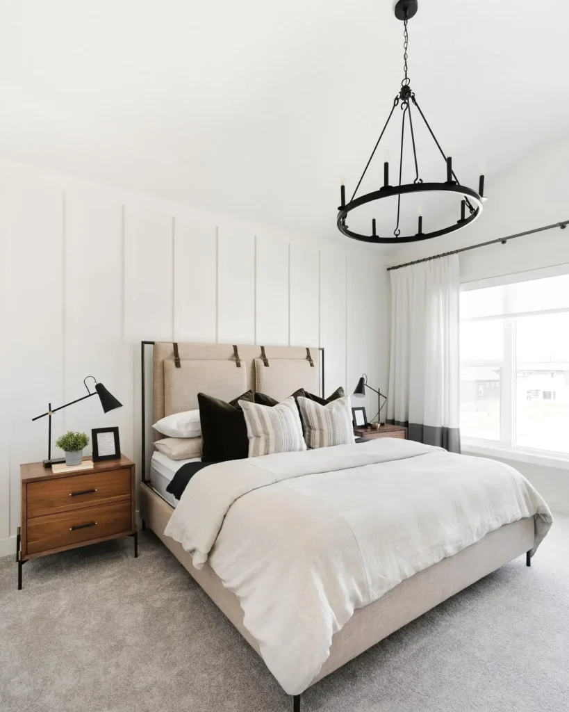 A Bedroom With A Neatly Arranged Cozy Bed And Soft Lighting