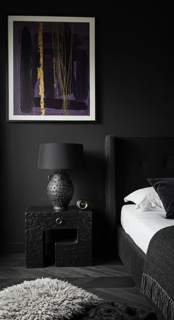 A Contemporary Black Bedroom With Modern