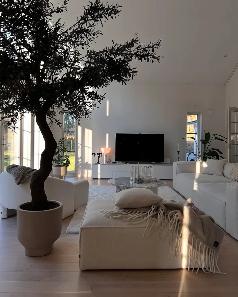 A Luxurious Living Room With Soft Textures And Elegant Chandeliers