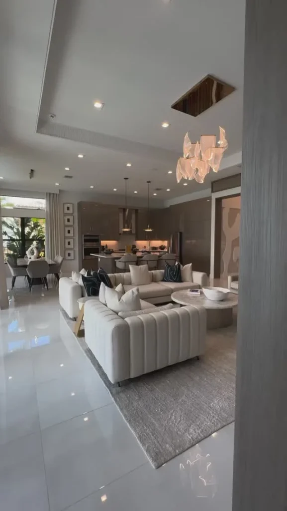 Bright Living Room With Floor-to-ceiling Windows And Fresh Greenery