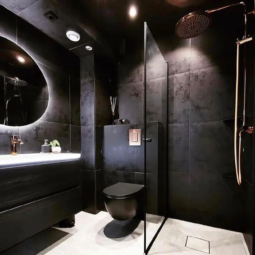 Dark Luxury Bathroom With Dramatic Lighting And Round Mirror