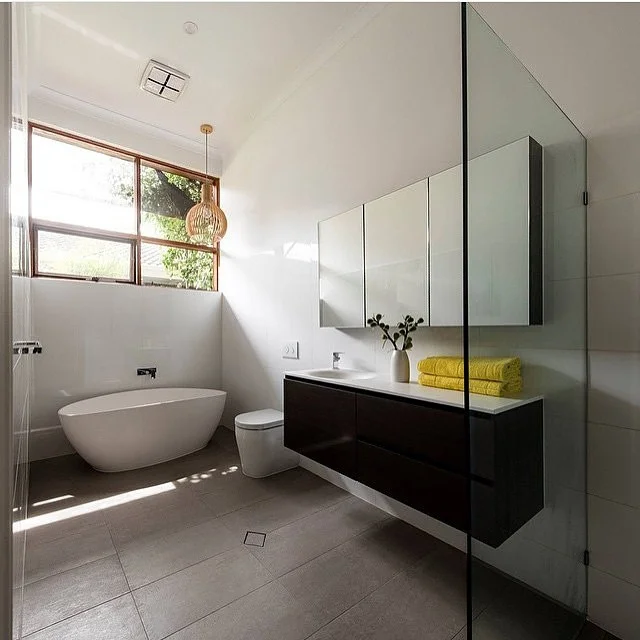 Elegant Black Bathroom With Freestanding Tub And Classic Windows