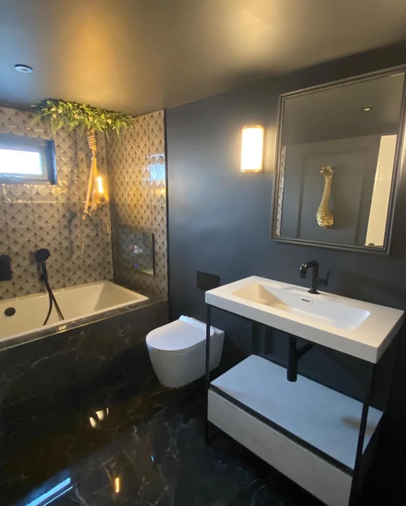 Sleek And Simple Modern Bathroom With Gold Accents