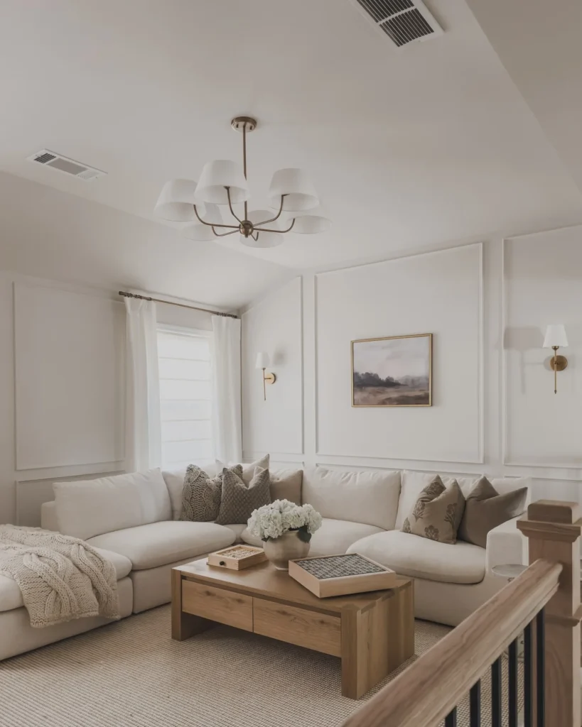 Warm Beige And White Living Room With Elegant Lighting Fixtures